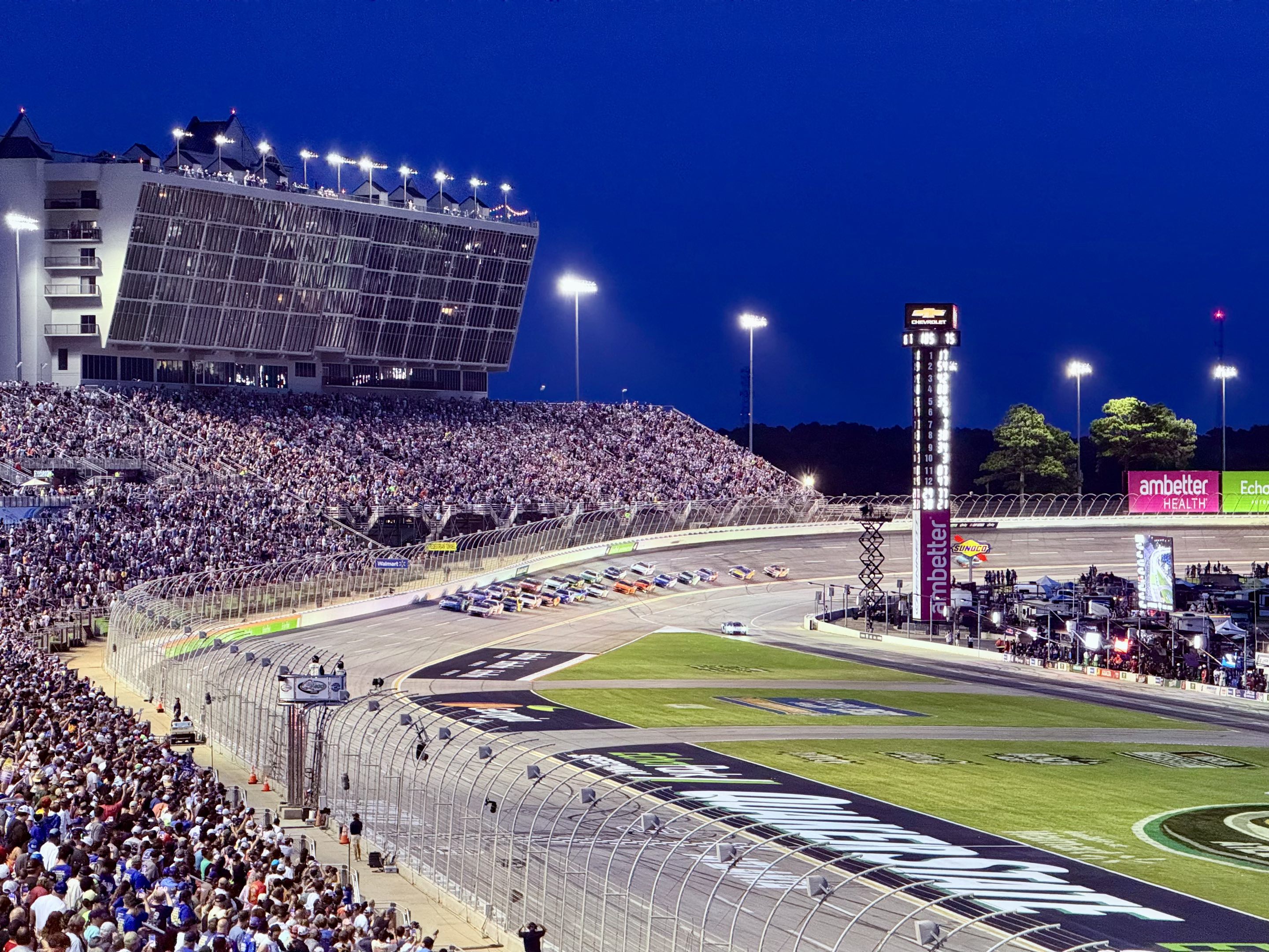 NASCAR Cup cars coming to the green flag at dusk at EchoPark Speedway in Atlanta