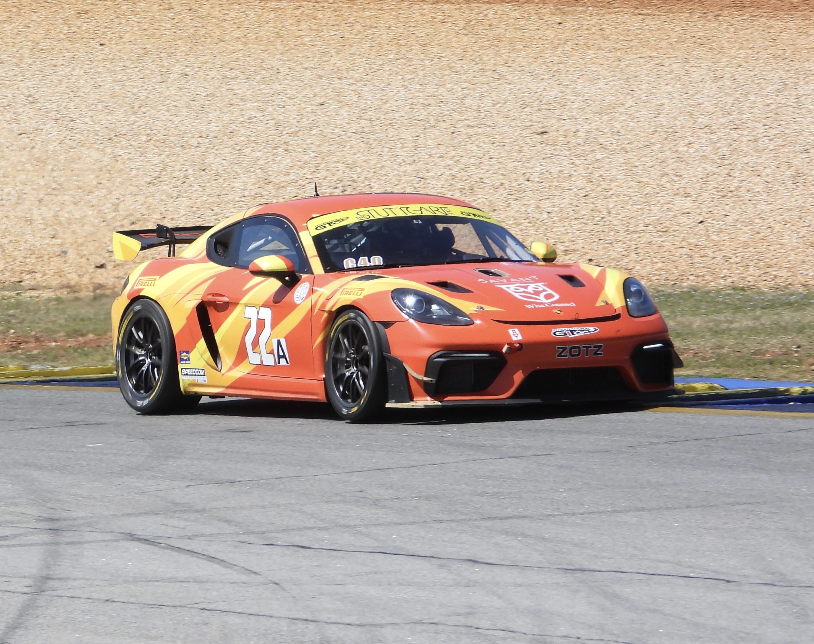 A Porsche Cayman GT car with a reasonably sized spoiler