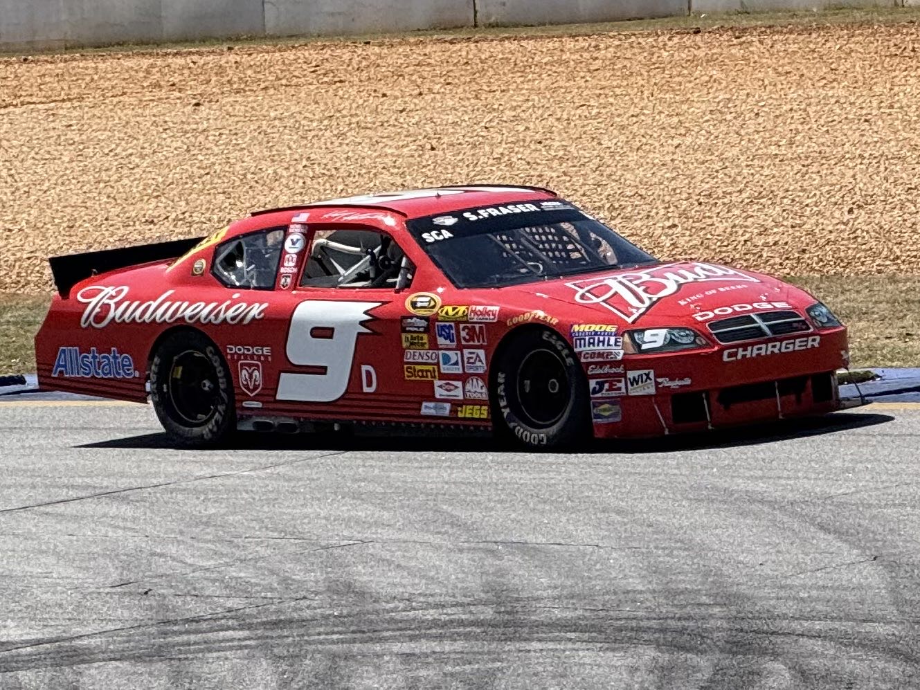 A #9 Chevrolet NASCAR stock car in Budweiser livery