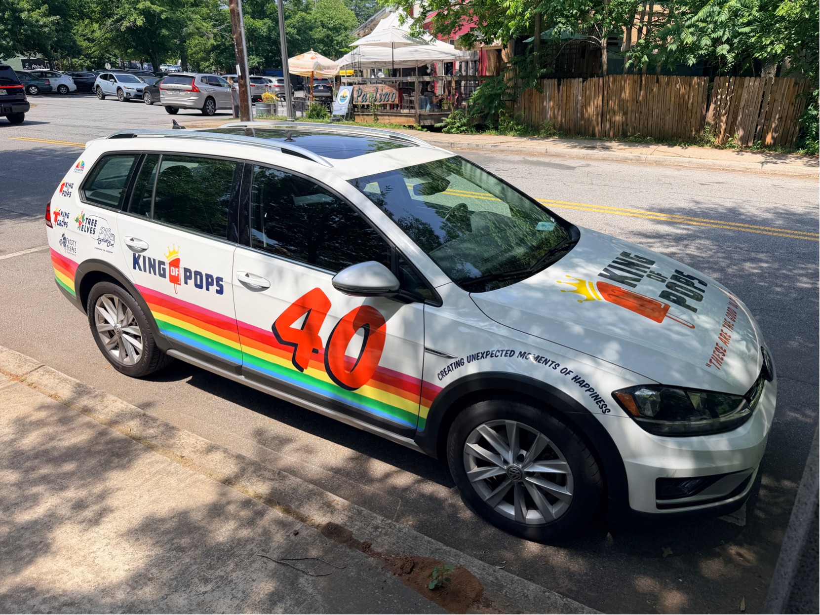 A Volkswagen painted in a popsicle company livery to look a little bit like a race car